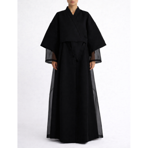Black modular kimono abaya shown in full length mode with attachable lower panel and clean back join line